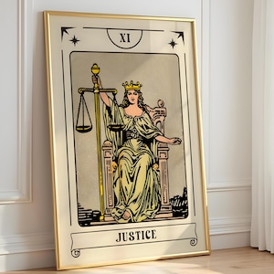 May include: A framed tarot card print featuring the Justice card. The artwork depicts a robed figure with a crown, holding scales and a sword, seated on a throne. The card is labeled "JUSTICE" at the bottom and "XI" at the top.
