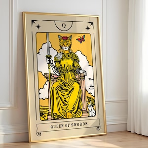 May include: A framed wall art print featuring a tarot card design titled Queen of Swords. The illustration depicts a cat with a crown sitting on a throne, holding a sword, with a butterfly above and a smaller cat beside it, all in yellow tones.