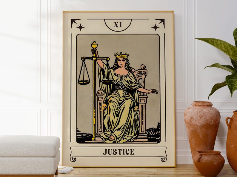 May include: A framed tarot card print featuring the Justice card. The artwork depicts a robed figure seated on a throne, holding scales and a sword. The card is labeled "JUSTICE" at the bottom, with the Roman numeral "XI" at the top.