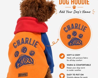 May include: Orange and blue dog hoodie with the name "Charlie" printed on the back. The hoodie has a red hood and blue sleeves. The text "Custom Name Dog Hoodie" is displayed above the dog's name. The hoodie is soft, warm, and easy to put on.