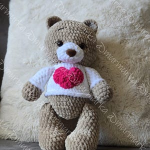 Amigurumi bear. Teddy love bear. Cute Amigurumi made in crochet stitch, handmade toy.