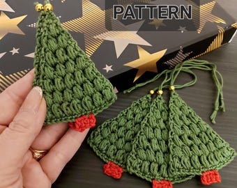 May include: Three green crocheted Christmas tree ornaments with red felt bases and gold beads. The ornaments are on a black and gold background with the word "PATTERN" in white.