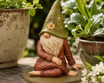 May include: A garden gnome figurine wearing a tall olive green hat decorated with a sculpted yellow flower and green leaves. The gnome has a long cream-colored beard, a round nose, and is dressed in a brown long-sleeved outfit while sitting.