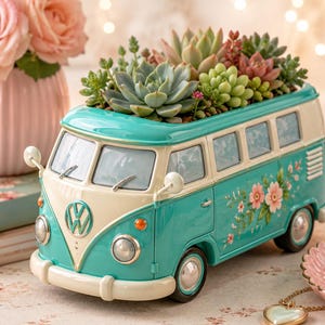 May include: A teal and cream-colored Volkswagen bus planter filled with succulents. The bus features a floral design and the VW logo. A pink vase with roses and a stack of books are in the background.