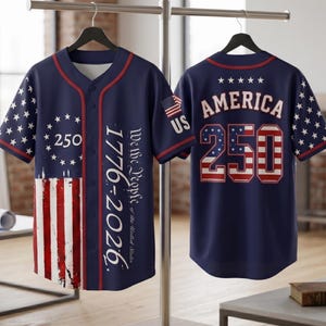 May include: A navy blue baseball jersey featuring a red-trimmed button-down front, white star patterns, and red and white stripes. The front displays "We the People of the United States 1776-2026" and "250". The back shows "AMERICA" and "250".