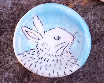 White bunny on Light Blue Pinch Pot by Lora Shelley