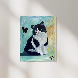Tableau chat avec papillon