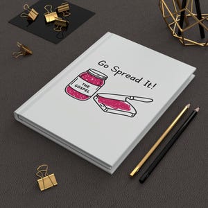 May include: White notebook with the text "Go Spread It!" and a drawing of a jar of jam labeled "The Gospel" and a knife spreading jam on a slice of bread.