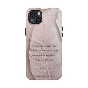 May include: A phone case with a pink and white floral design. The case features a quote from Psalm 139:14, "I praise you because I am fearfully and wonderfully made; your works are wonderful, I know that full well."