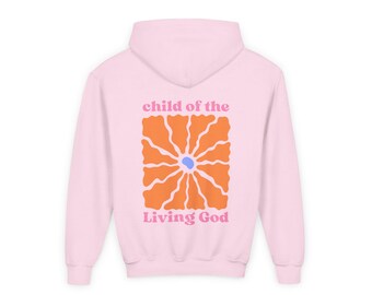 May include: A light pink hoodie with a large orange flower design on the back. The flower has a blue center and radiating petals. The words "child of the" and "Living God" are printed above and below the flower in pink and orange.