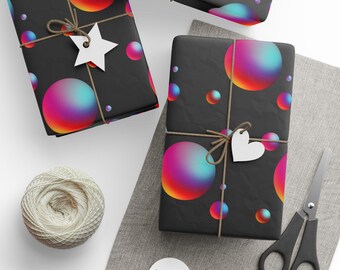 May include: Three gift boxes wrapped in black paper with a repeating pattern of iridescent, multi-colored spheres. The boxes are tied with twine and decorated with white paper stars and hearts.