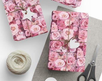 May include: Two pink gift boxes wrapped in floral patterned paper with pink roses and other flowers. The boxes are tied with twine and decorated with white paper stars and hearts.