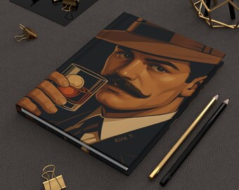 May include: A black and brown notebook with a vintage illustration of a man wearing a hat and drinking from a glass. The man has a mustache and is looking to the side. The notebook has the text "Kira Y." printed on the cover.