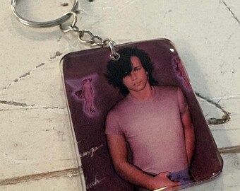 Llavero con la portada del casete Uh-Huh de John Mellencamp