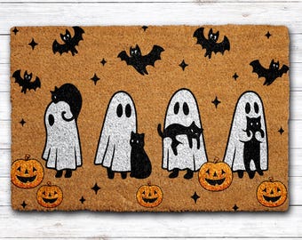 May include: A rectangular doormat with a Halloween theme. The mat features four white ghosts, black cats, bats, and jack-o'-lanterns on a brown background. The design includes black stars and is suitable for seasonal home decor.