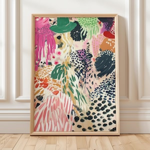 May include: Abstract art print in a wooden frame. The artwork features a collage of colorful patterns, including polka dots, stripes, and brushstrokes in shades of pink, green, orange, and black. A green hat is visible in the upper portion of the image.