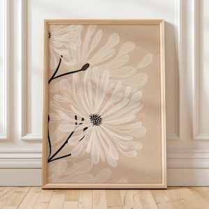 May include: A framed art print depicting large white daisy-like flowers with black stems and centres against a beige backdrop. The artwork is in a light wood frame, suitable for home decor.