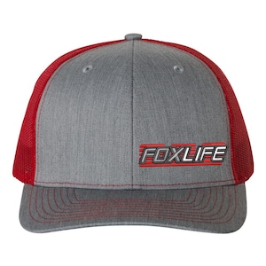 May include: A gray and red trucker hat with a red mesh back and the word "FOXLIFE" in red and silver lettering.