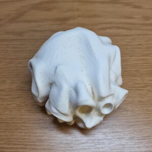 3D-printed white aquarium fish playground with maze-like tunnels and multiple openings. Ideal for fish hiding, breeding, and stress relief. Enhances aquarium aesthetics while providing an engaging and functional habitat for aquatic pets.