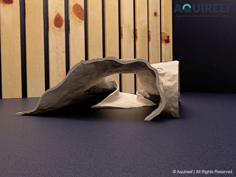 Side view of the Riptide Aquarium Cave STL file on a flat surface, emphasizing its textured design, dual entrances, and durability. Ideal for 3D printing to create aquatic or terrarium decorations.