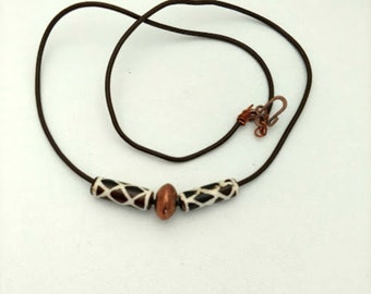 Brown and Cream Bone With Copper Bead on a 23 Inch Brown Leather Cord