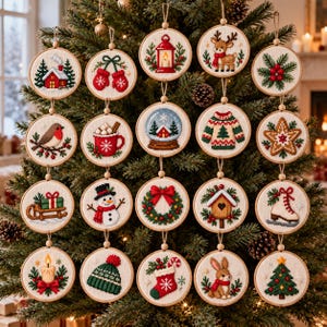 May include: A collection of twenty circular embroidery hoop ornaments featuring various Christmas motifs including a red house, mittens, a lantern, a reindeer, holly, a robin, cocoa, a snow globe, a jumper, a star, a sledge, a snowman, a wreath, a birdhouse, an ice skate, a candle, a knit hat, a stocking, a rabbit, and a tree.