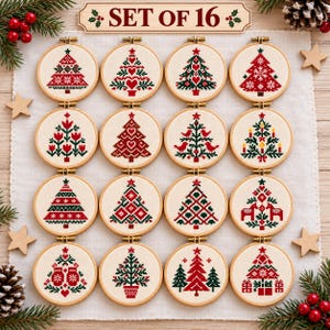 May include: A set of 16 circular wooden embroidery hoops featuring cross-stitch designs of Christmas trees in red and green thread on cream fabric. Each hoop displays a unique tree pattern, including hearts, birds, and gifts. The text SET OF 16 is visible.