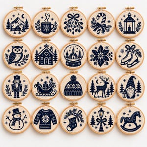 May include: A collection of twenty circular embroidery hoops featuring dark blue stitched designs on a light fabric background. The patterns include winter and holiday motifs such as a mountain cabin, mug, mistletoe, candy cane, lantern, owl, house, snow globe, poinsettia, ice skates, nutcracker, sleigh, beanie, deer, gnome, snowman, sweater, stocking, street lamp, and rocking horse.