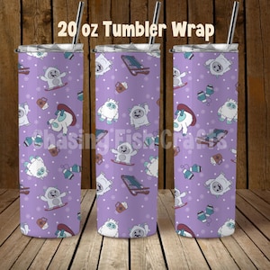 May include: A 20 oz tumbler wrap with a purple background featuring a repeating pattern of cartoon snow creatures, sleds, mittens, and coffee cups. The tumbler has a silver lid and straw. The text "20 oz Tumbler Wrap" is at the top.
