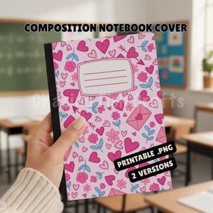 May include: A composition notebook cover with a pink background and a pattern of pink hearts, flowers, and arrows. The cover has a white rectangular label for the owner's name and the text "COMPOSITION NOTEBOOK COVER". The notebook is held in a classroom setting.
