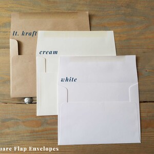 May include: Three square flap envelopes in different colors: light kraft, cream, and white. The envelopes are arranged from left to right, with the light kraft envelope on the left, the cream envelope in the middle, and the white envelope on the right. The envelopes are all the same size and have a square flap.