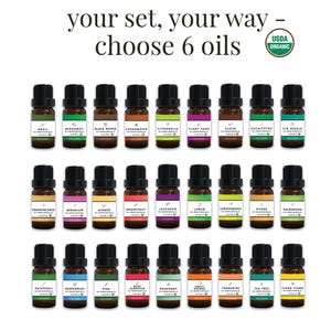 May include: A collection of 24 essential oil bottles with black caps and labels featuring various botanical names. The image includes the text "your set, your way - choose 6 oils" and a USDA Organic seal. The oils are arranged in rows.