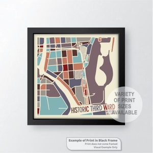 Puede incluir: Una impresión de mapa colorida del barrio histórico de Third Ward en Milwaukee, Wisconsin. La impresión está enmarcada en un marco negro y está disponible en una variedad de tamaños.