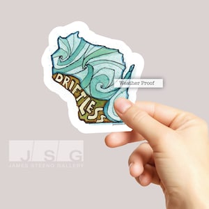 May include: A sticker of the state of Wisconsin with the word "Driftless" written in a stylized font. The sticker is weatherproof and has a blue and green watercolor design.