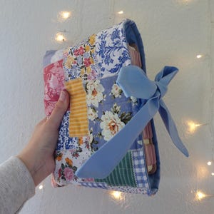 Handmade Quilted Bible Sleeve: Floral Patchwork Cover with Blue Bow