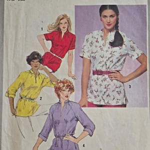 May include: A sewing pattern for a blouse with a V-neck and a tie belt. The pattern includes four different views of the blouse, each with a different colour and style. The pattern is for sizes 22 1/2 and 24 1/2.