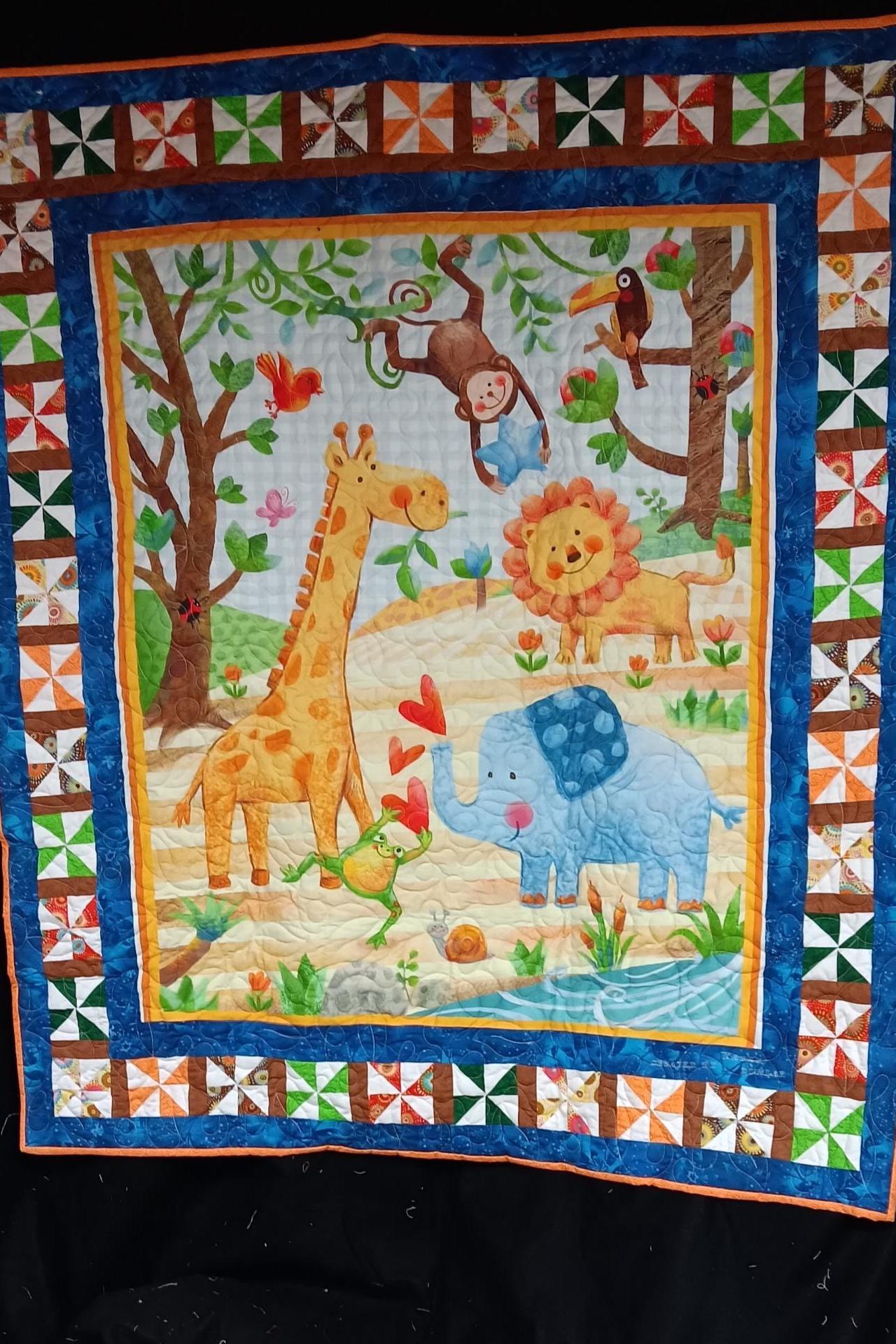 Jungle animal baby quilt with a lot of bright color and pin wheels around the outside.