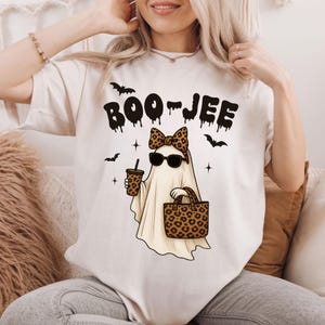 Boujee ghost with leopard print accessories and iced coffee