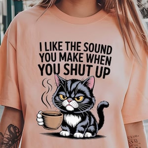 High-resolution PNG of mad cat with coffee quote.