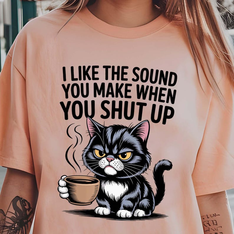High-resolution PNG of mad cat with coffee quote.