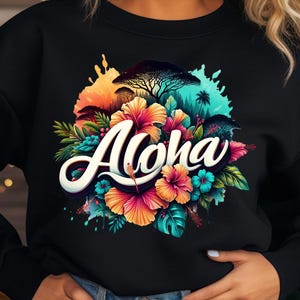 May include: Black sweatshirt with a colorful floral design and the word "Aloha" in a stylized font.
