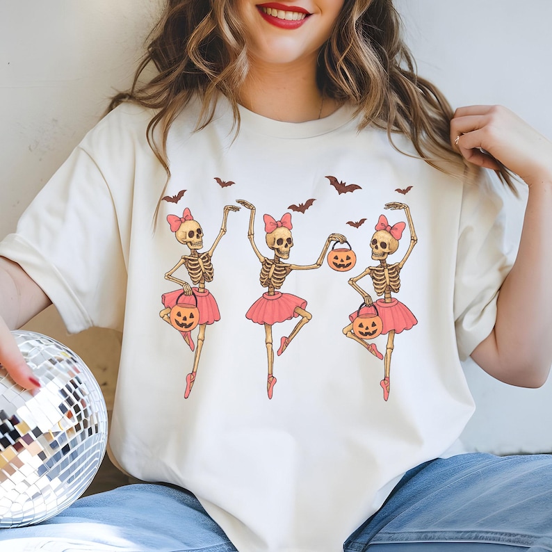 Cute skeleton ballerina in pink tutu dancing with pumpkins