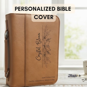 May include: A brown leather Bible cover with the text "PERSONALIZED BIBLE COVER" at the top. The cover features the name "Crystal Bloom" and a floral design. The Bible cover also includes the text "Matthew 17:20 Faith Can Move Mountains."