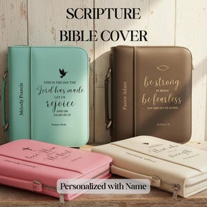 May include: A collection of scripture Bible covers in various colors, including teal, brown, pink, and cream. Each cover is personalized with names and inspirational quotes. The covers have a zipper closure and a handle.