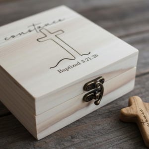 May include: A set of three ceramic mugs with a speckled, matte finish. The mugs are in shades of cream, light gray, and dark gray. Each mug has a simple, modern design and a rounded handle.