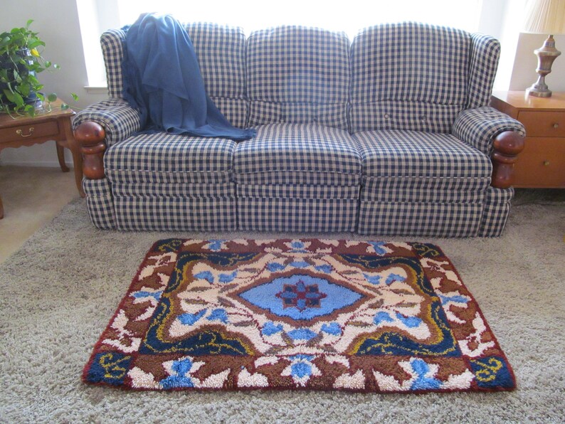 Vintage Extra Large Latch Hook Rug Features Medallion Center Scrolls Leaves And Flourishes Blue Earth Tones Color Story