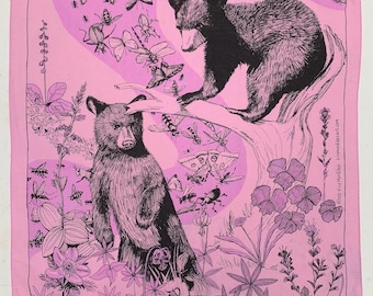 May include: Pink square bandana featuring a black and white illustration of two bears, insects, and flowers. The bears are in a forest setting with butterflies, bees, and other insects. The bandana has a pink border.