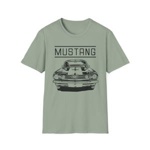 Vintage Ford Mustang T-shirt exuding a retro vibe, perfect for car enthusiasts and vintage lovers. This unisex T-shirt, made from 100% ring-spun cotton, offers a lightweight and comfortable fit for all-year wear. With a classic crew neckline and vers