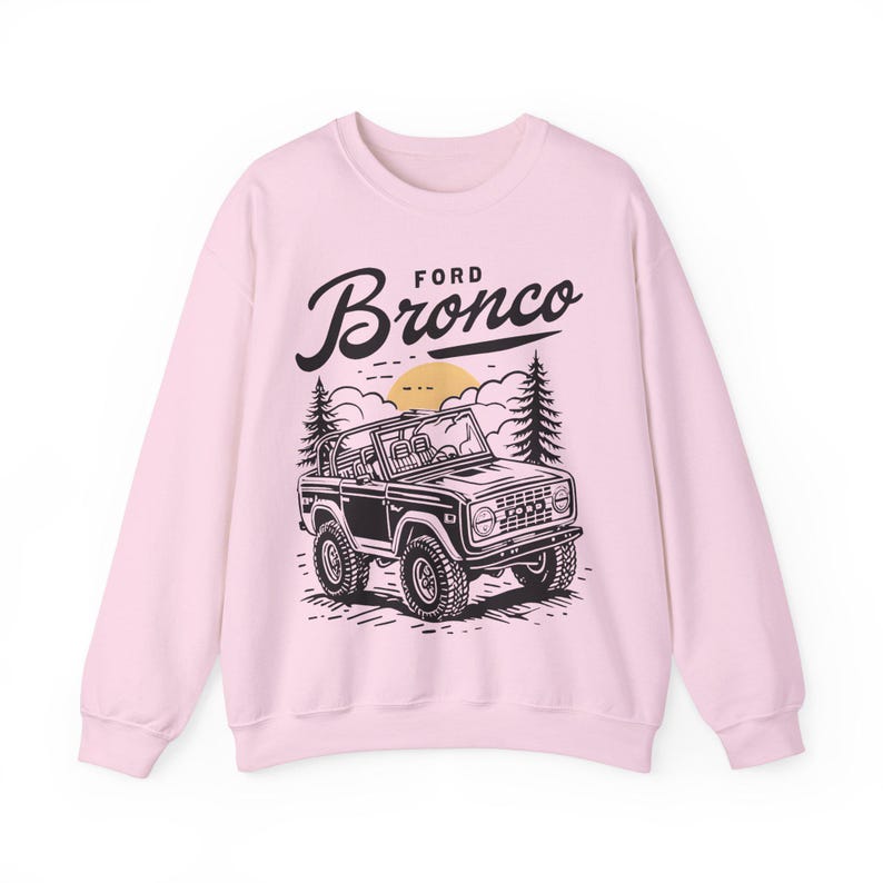 The Ford Bronco Adventure Sweatshirt exudes a sense of adventure and ruggedness, perfect for outdoor enthusiasts and fans of the iconic vehicle. This cozy sweatshirt is made with a medium-heavy fabric blend of 50% cotton and 50% polyester, providing