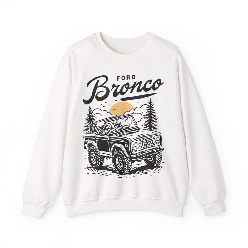 The Ford Bronco Adventure Sweatshirt exudes a sense of adventure and ruggedness, perfect for outdoor enthusiasts and fans of the iconic vehicle. This cozy sweatshirt is made with a medium-heavy fabric blend of 50% cotton and 50% polyester, providing